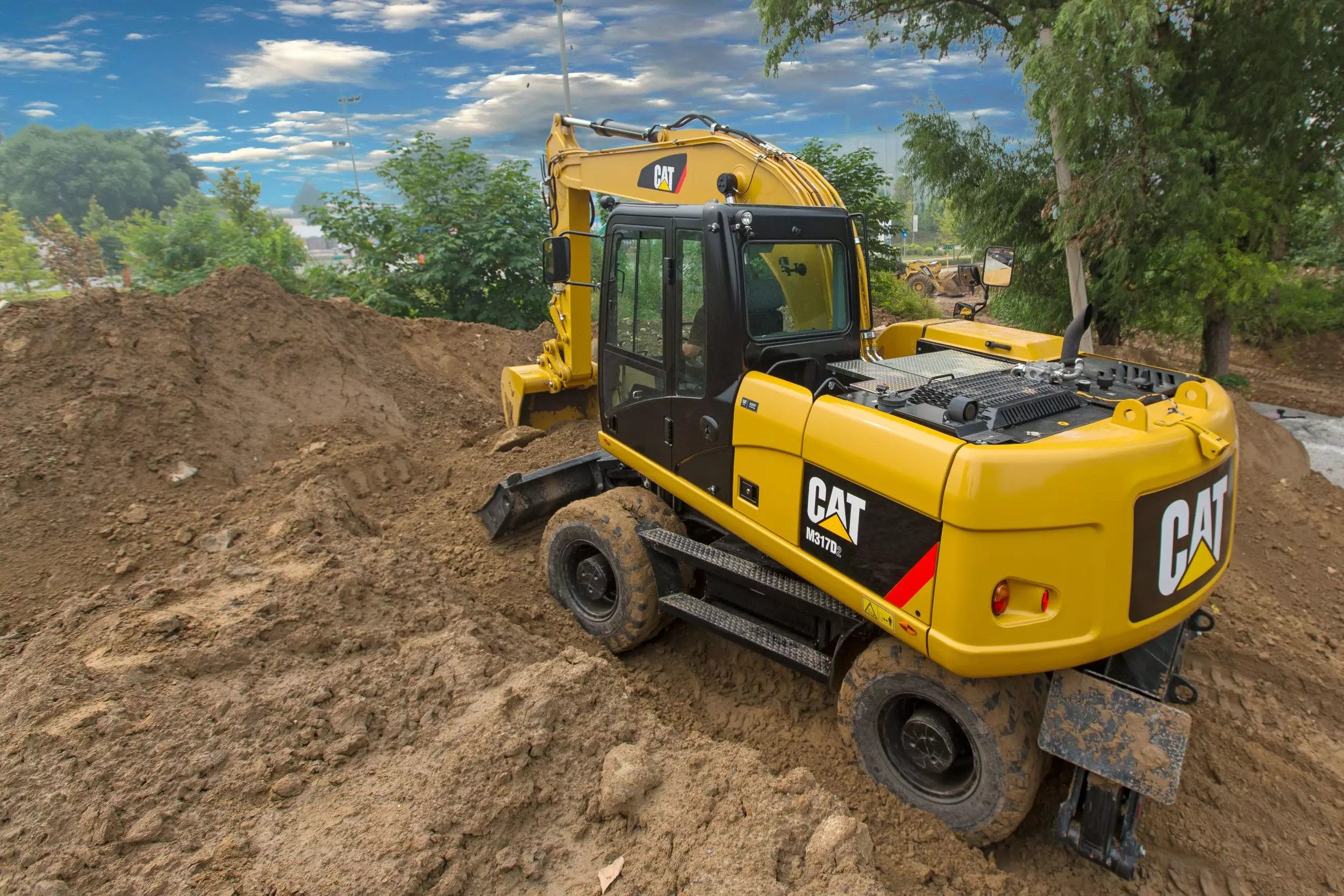 Caterpillar M317D2, Колесные экскаваторы