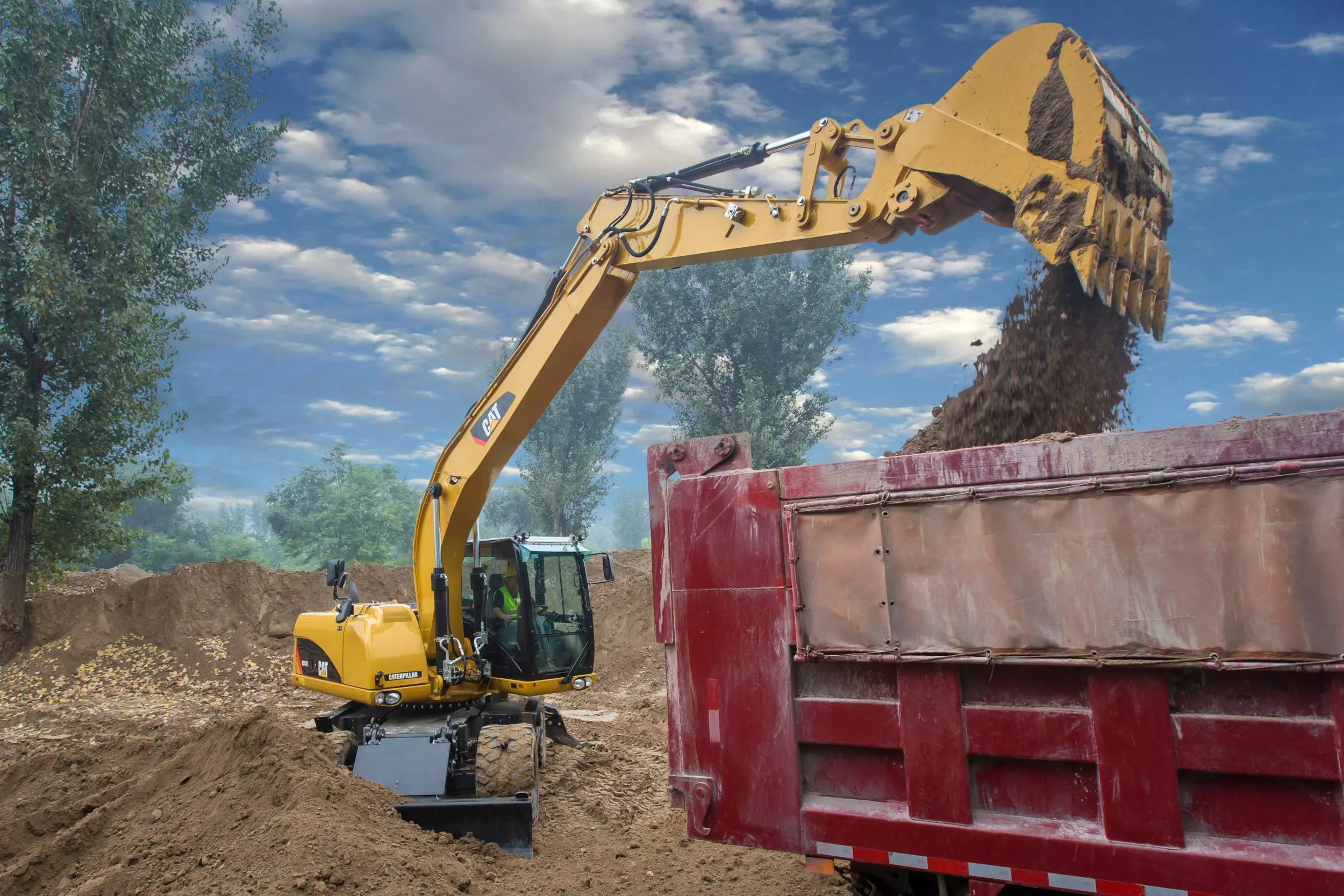 Caterpillar M317D2, Колесные экскаваторы