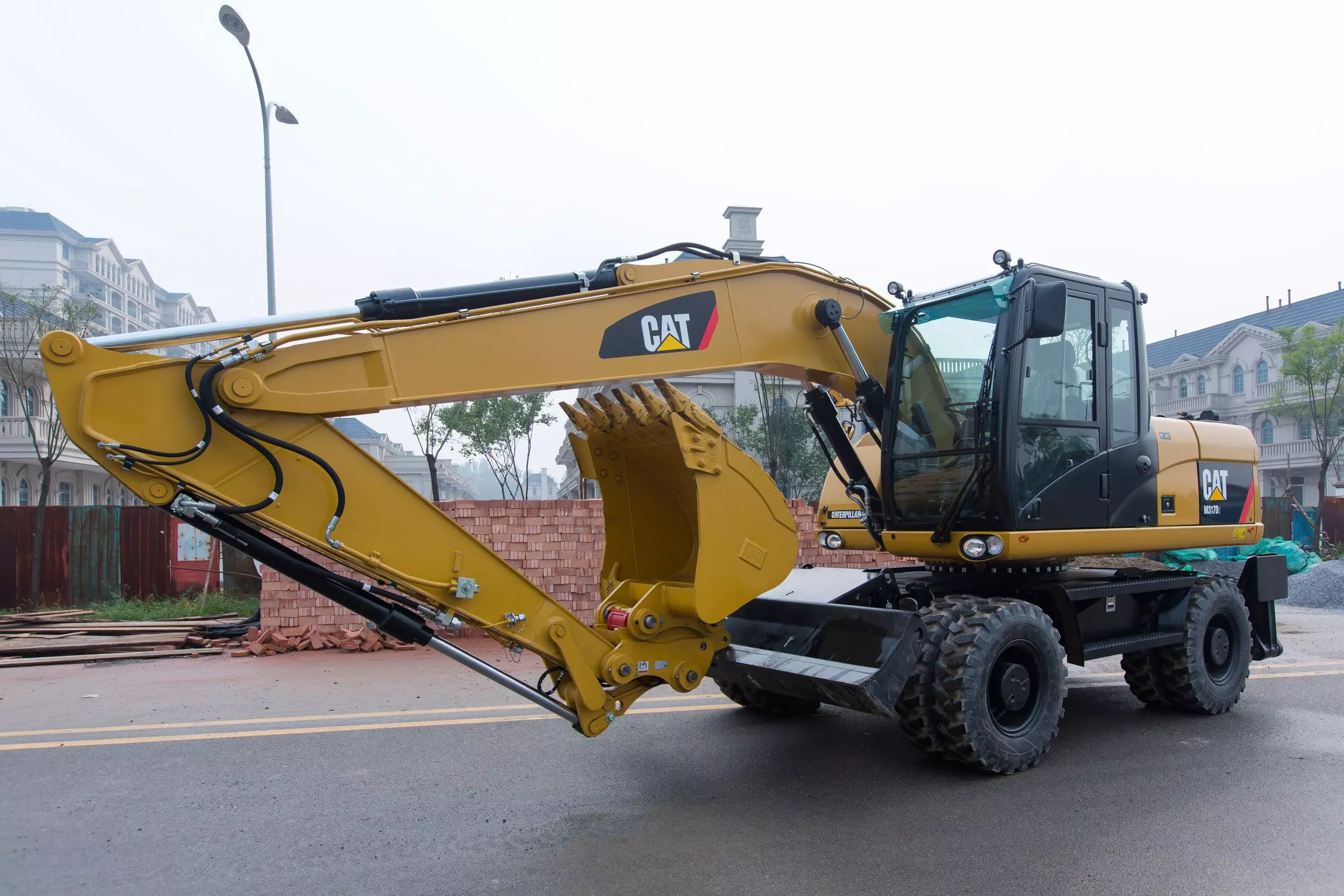 Caterpillar M317D2, Колесные экскаваторы